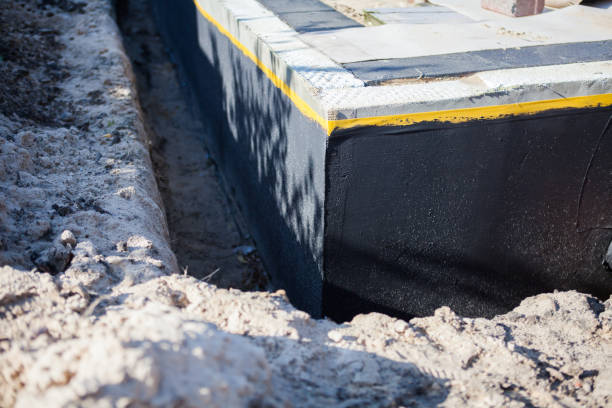 Professional Waterproofing technician working in Latonia, KY